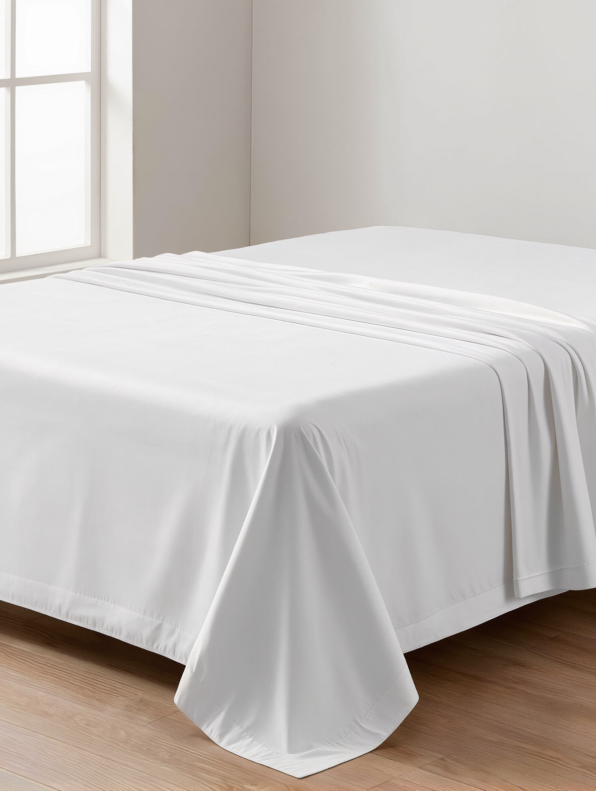 Le drap plat Douce Nuit drapé sur un lit, vue rapprochée